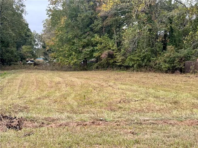 a view of a playground with basketball court