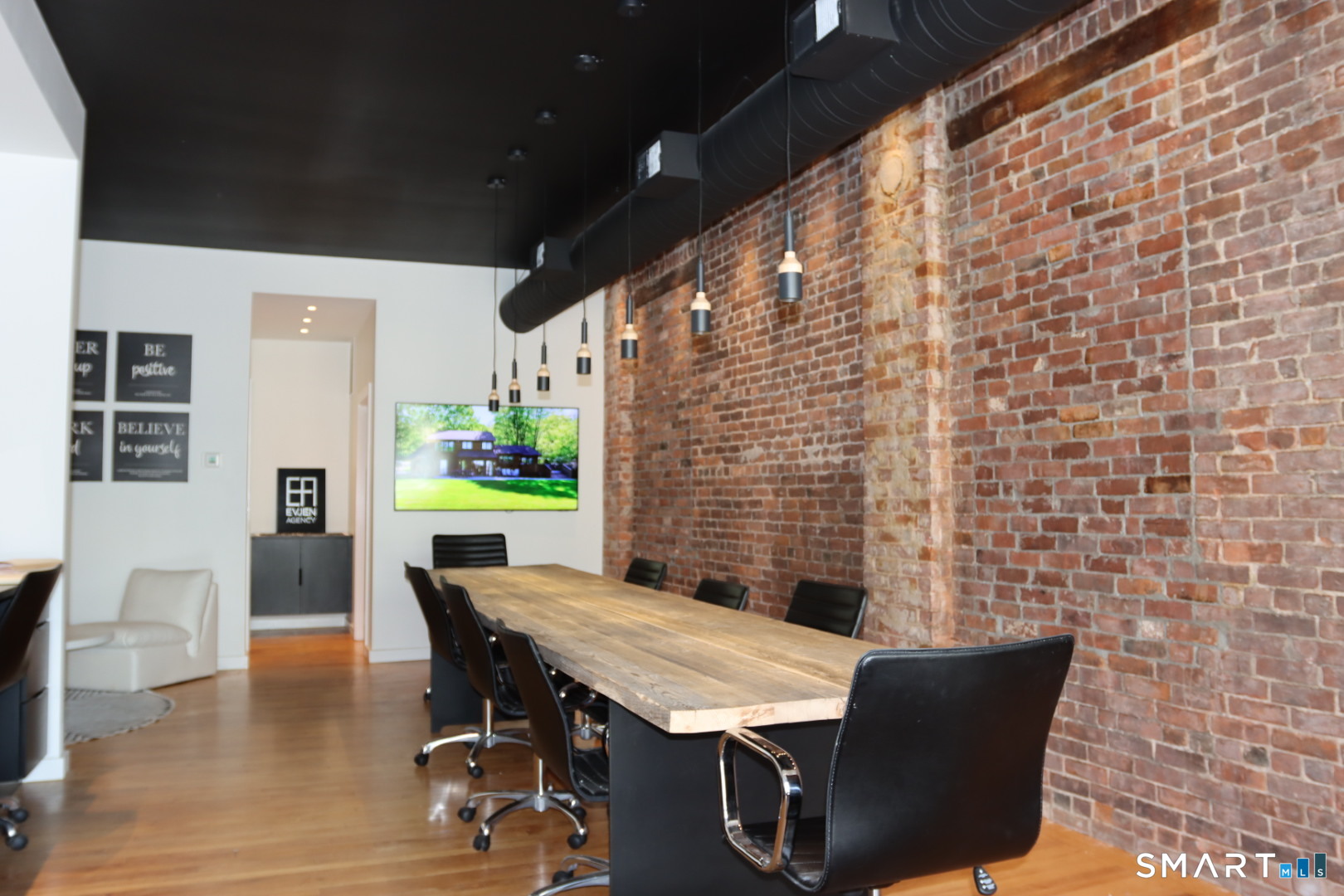 100 Center Street Southington, CT 06489 - Photo 13 of 19 a view of a patio with table and chairs with wooden floor and fence