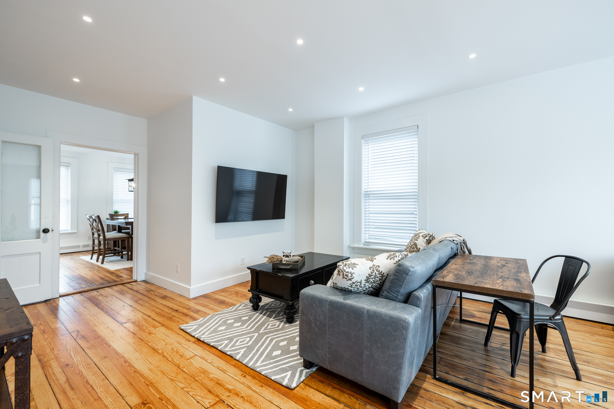 100 Center Street Southington, CT 06489 - Photo 7 of 19 a living room with furniture and a flat screen tv