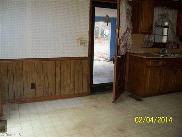 480 Rockett Road Randleman, NC 27317 - Photo 3 of 13 Breakfast. Breakfast/Dining Area off Kitchen. Side exterior door leading to open-ended garage.