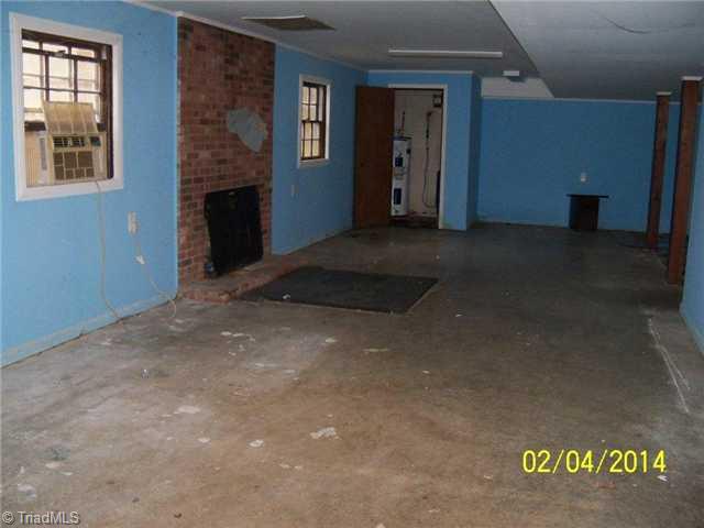 480 Rockett Road Randleman, NC 27317 - Photo 9 of 13 Other. Full unfinished basement with FP and single garage.