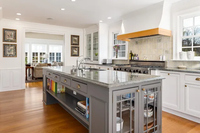 a kitchen with stainless steel appliances granite countertop a stove and a sink