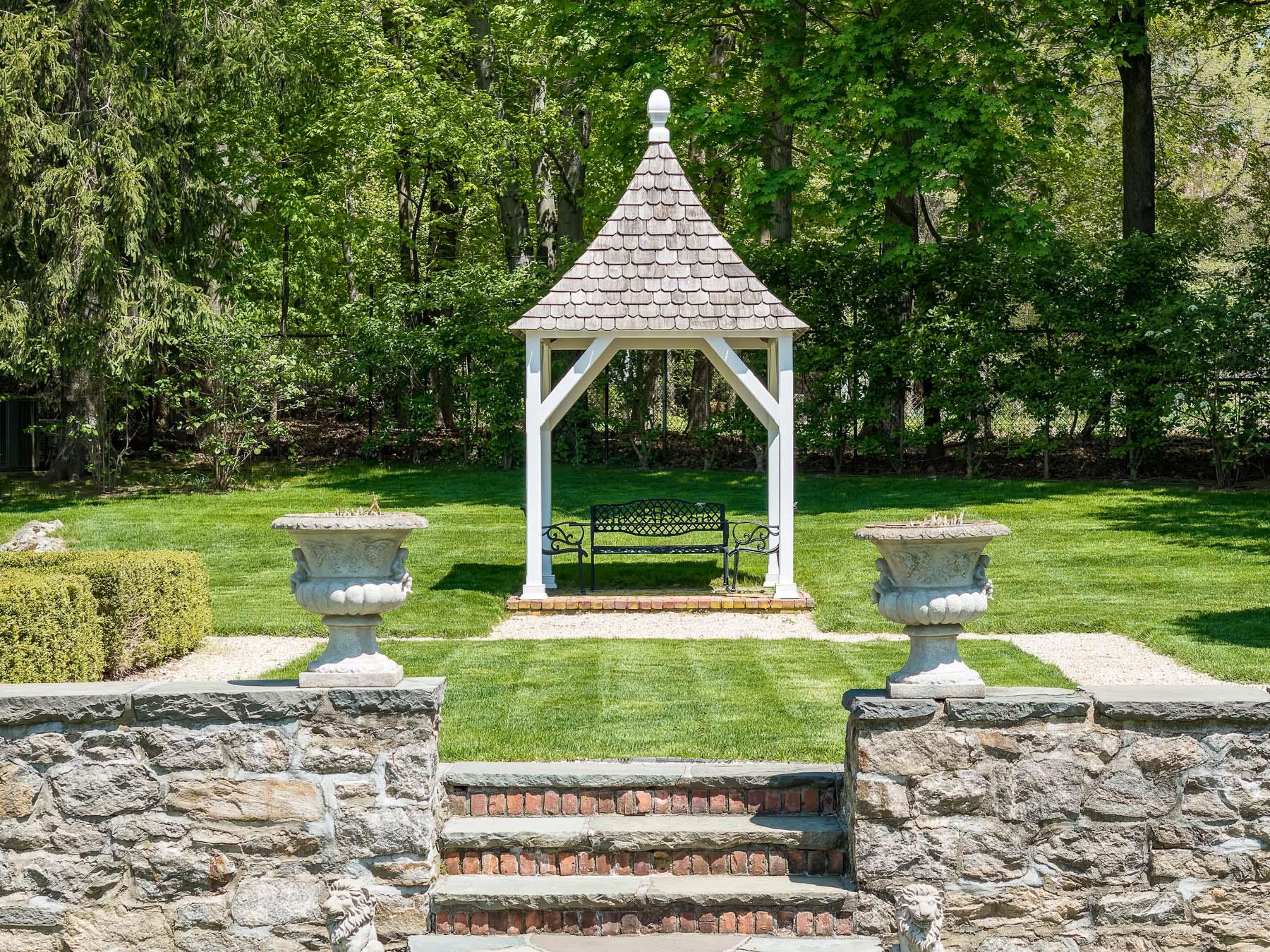 177 Old Briarcliff Road Briarcliff Manor, NY 10510 - Photo 41 of 49 a front view of a house with garden