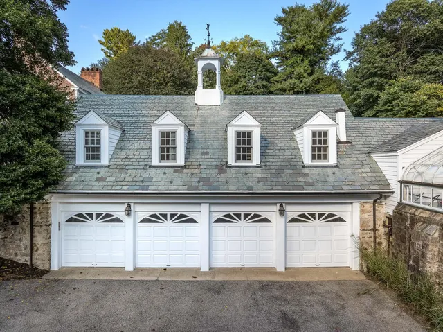 an aerial view of a house with outdoor space and street view