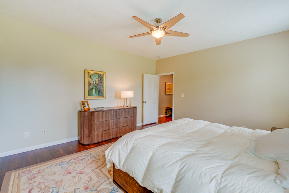 3550 East Bishop Road Mount Vernon, IL 62864 - Photo 28 of 61 a bedroom with a bed and a chandelier