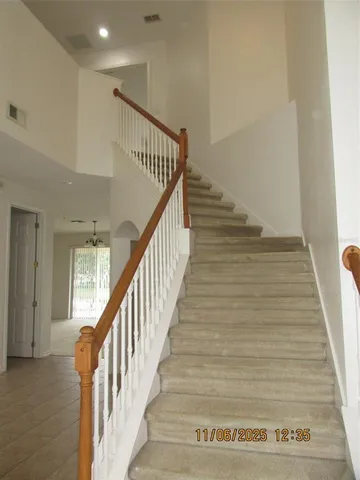 a view of staircase with wooden floor and stairs