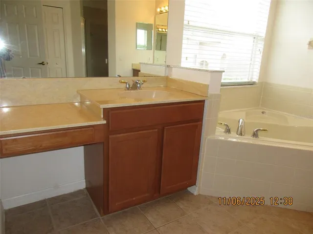 a bathroom with a sink and a bathtub