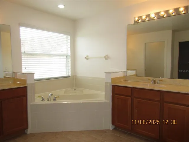 a bathroom with a bathtub and a sink