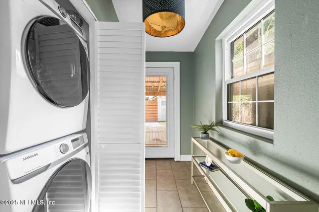 a view of a hallway with washer and dryer