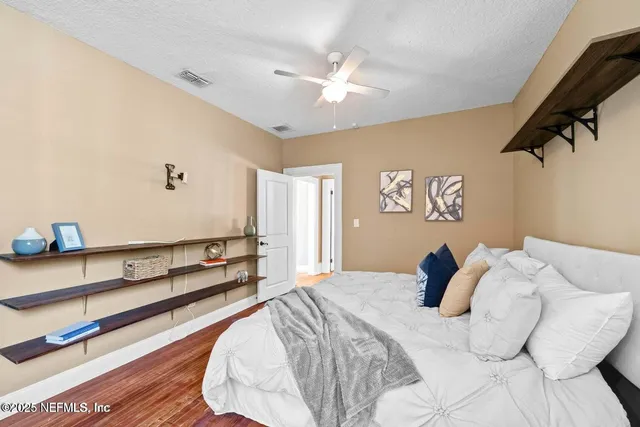 a bed room with a bed and a chandelier