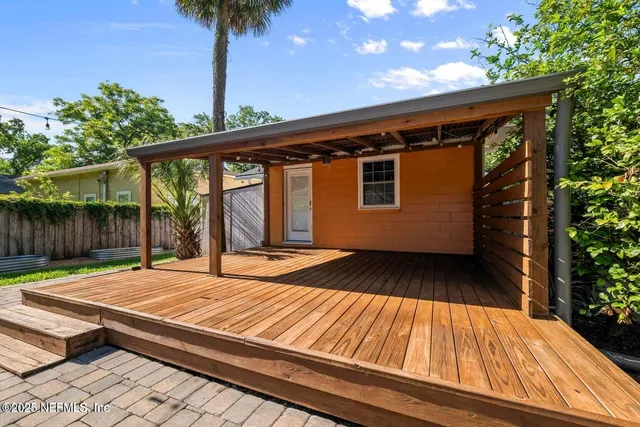 a view of backyard with a patio