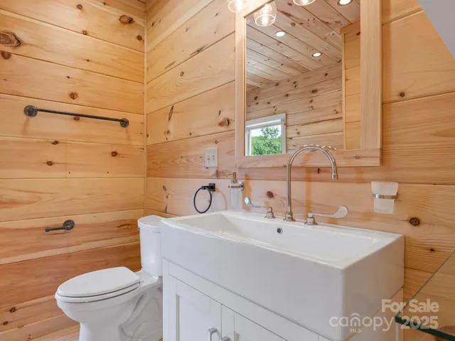 a view of a balcony with a table and chairs