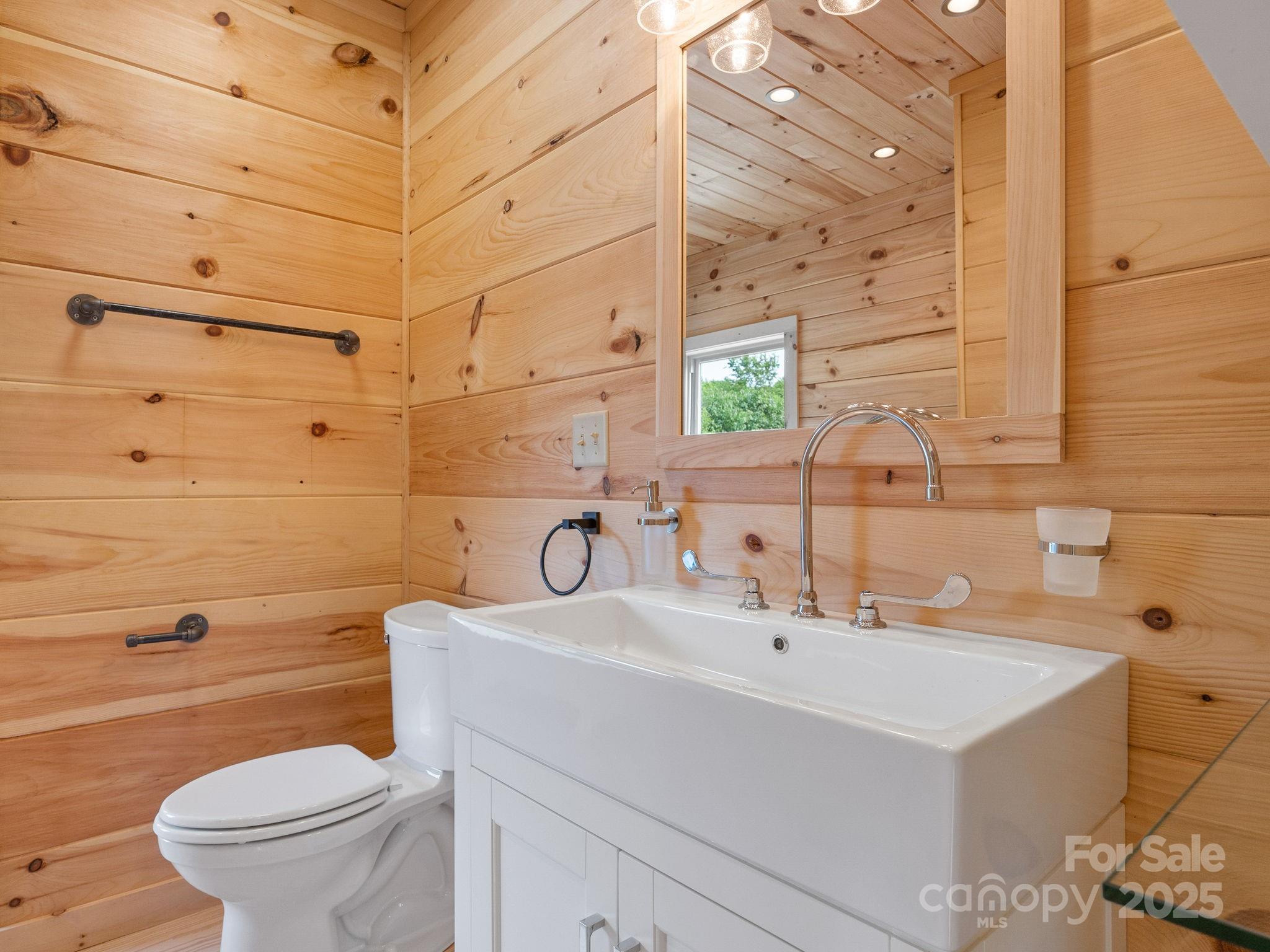 185 Robinson Acres Cove Lane Rutherfordton, NC 28139 - Photo 12 of 37 a bathroom with a sink a toilet and shower