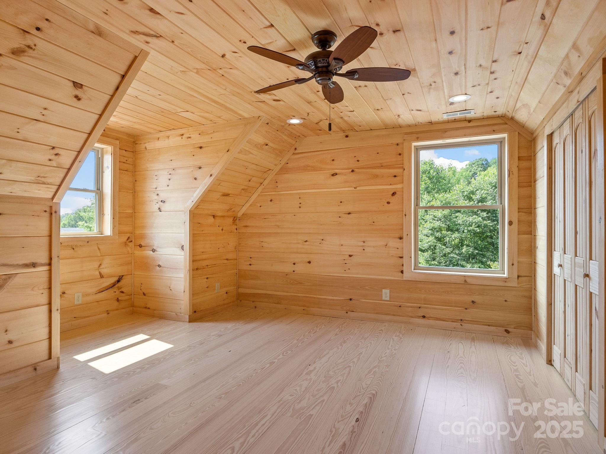 185 Robinson Acres Cove Lane Rutherfordton, NC 28139 - Photo 15 of 37 a view of empty room with wooden floor and fan