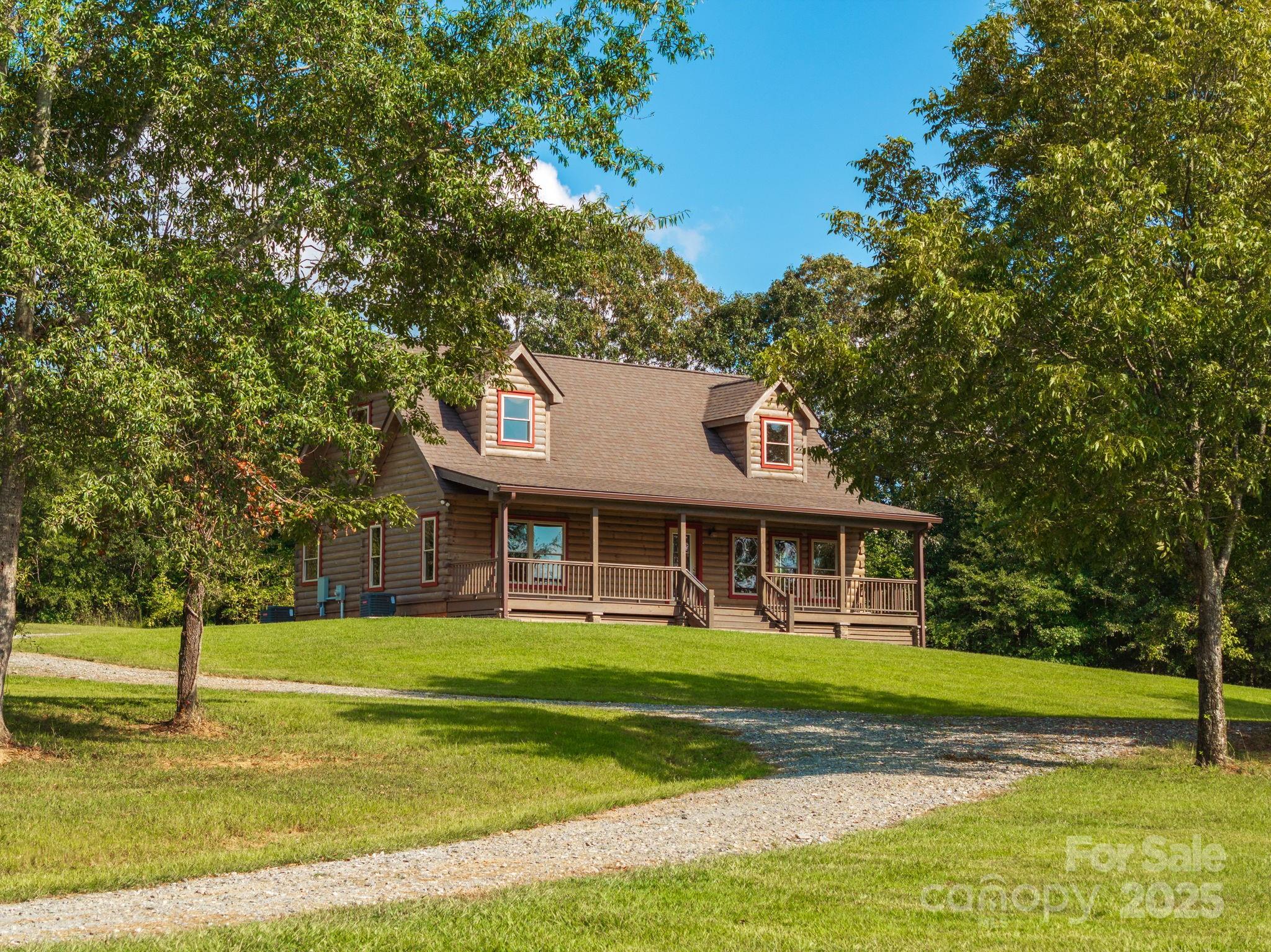 185 Robinson Acres Cove Lane Rutherfordton, NC 28139 - Photo 2 of 37 a view of a house with a swimming pool