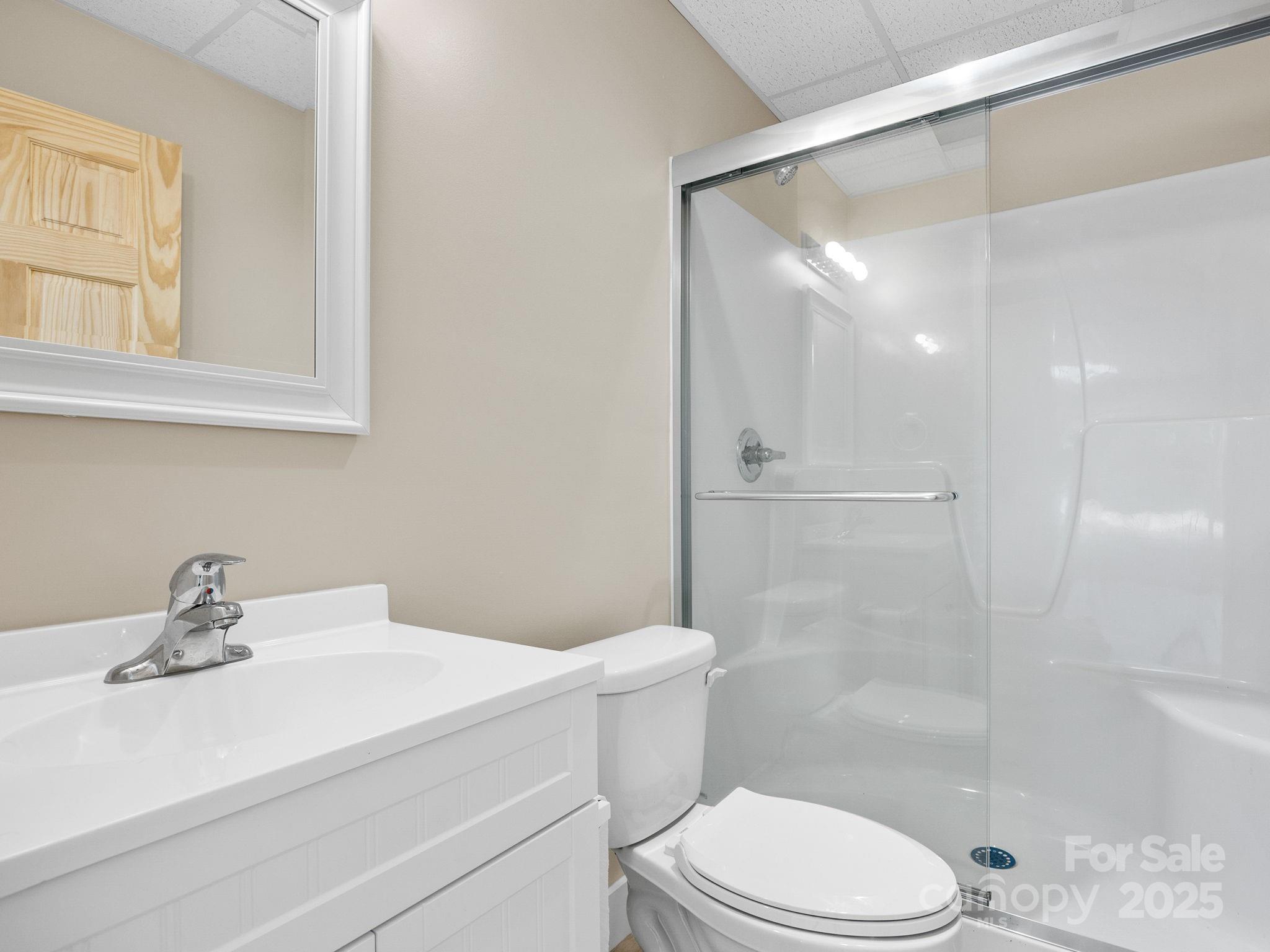 185 Robinson Acres Cove Lane Rutherfordton, NC 28139 - Photo 23 of 37 a bathroom with a sink a toilet and shower
