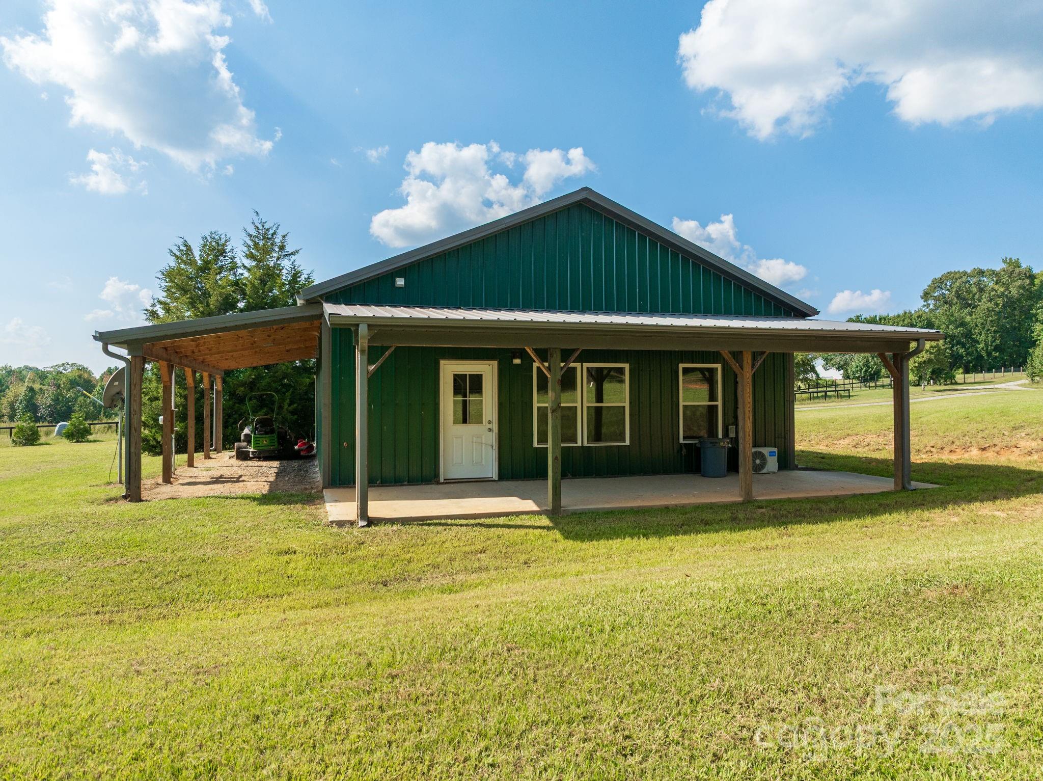 185 Robinson Acres Cove Lane Rutherfordton, NC 28139 - Photo 24 of 37 a view of a house with swimming pool and a yard