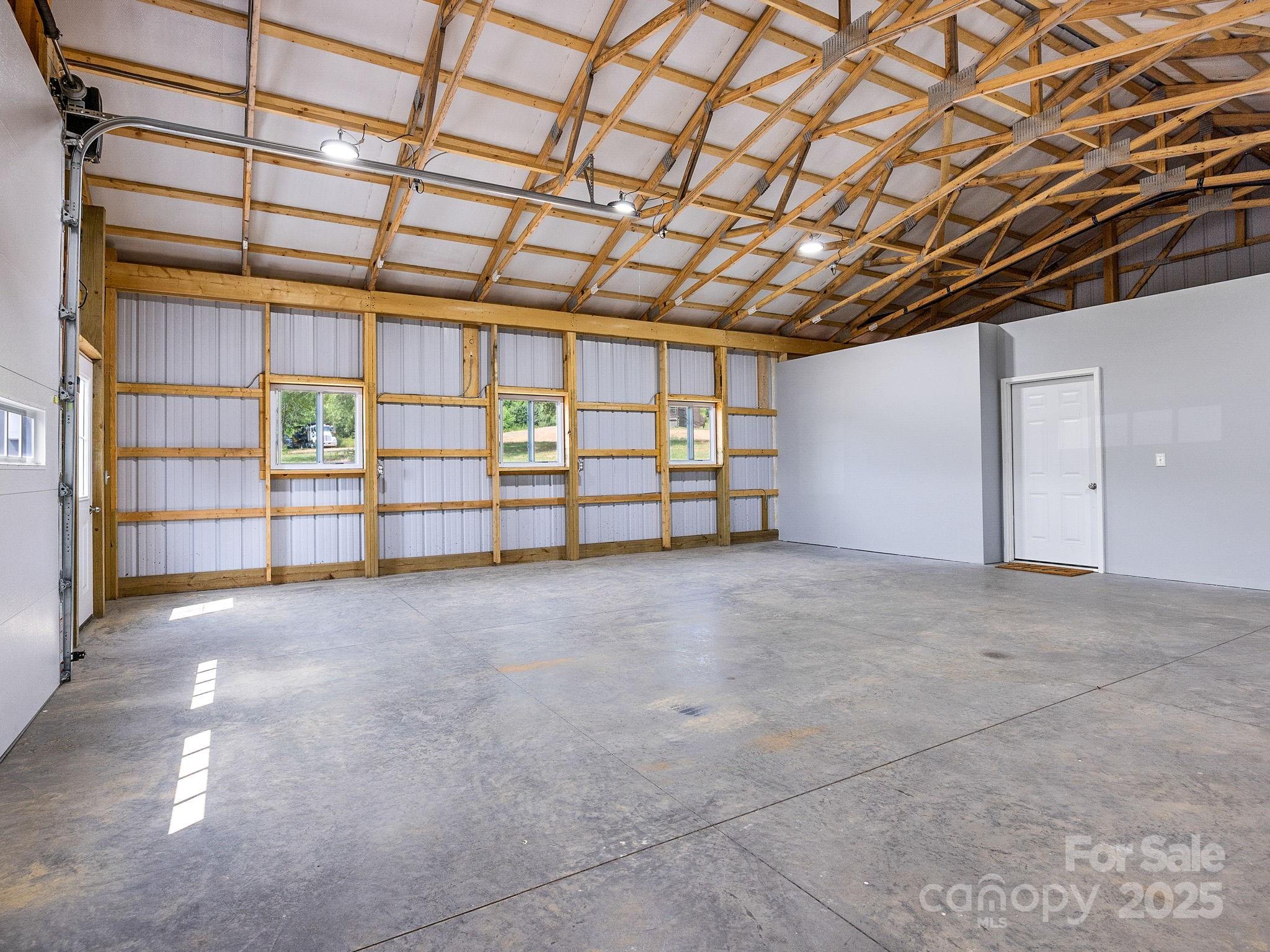 185 Robinson Acres Cove Lane Rutherfordton, NC 28139 - Photo 29 of 37 a view of an empty room with windows