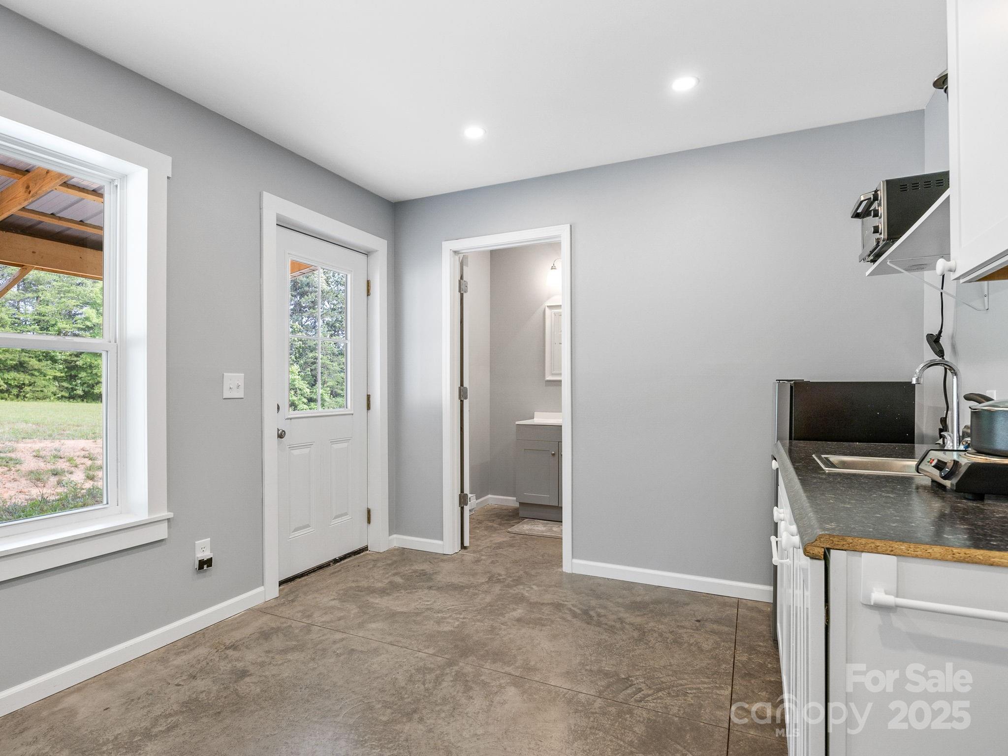 185 Robinson Acres Cove Lane Rutherfordton, NC 28139 - Photo 31 of 37 a view of a livingroom with a flat screen tv and a window