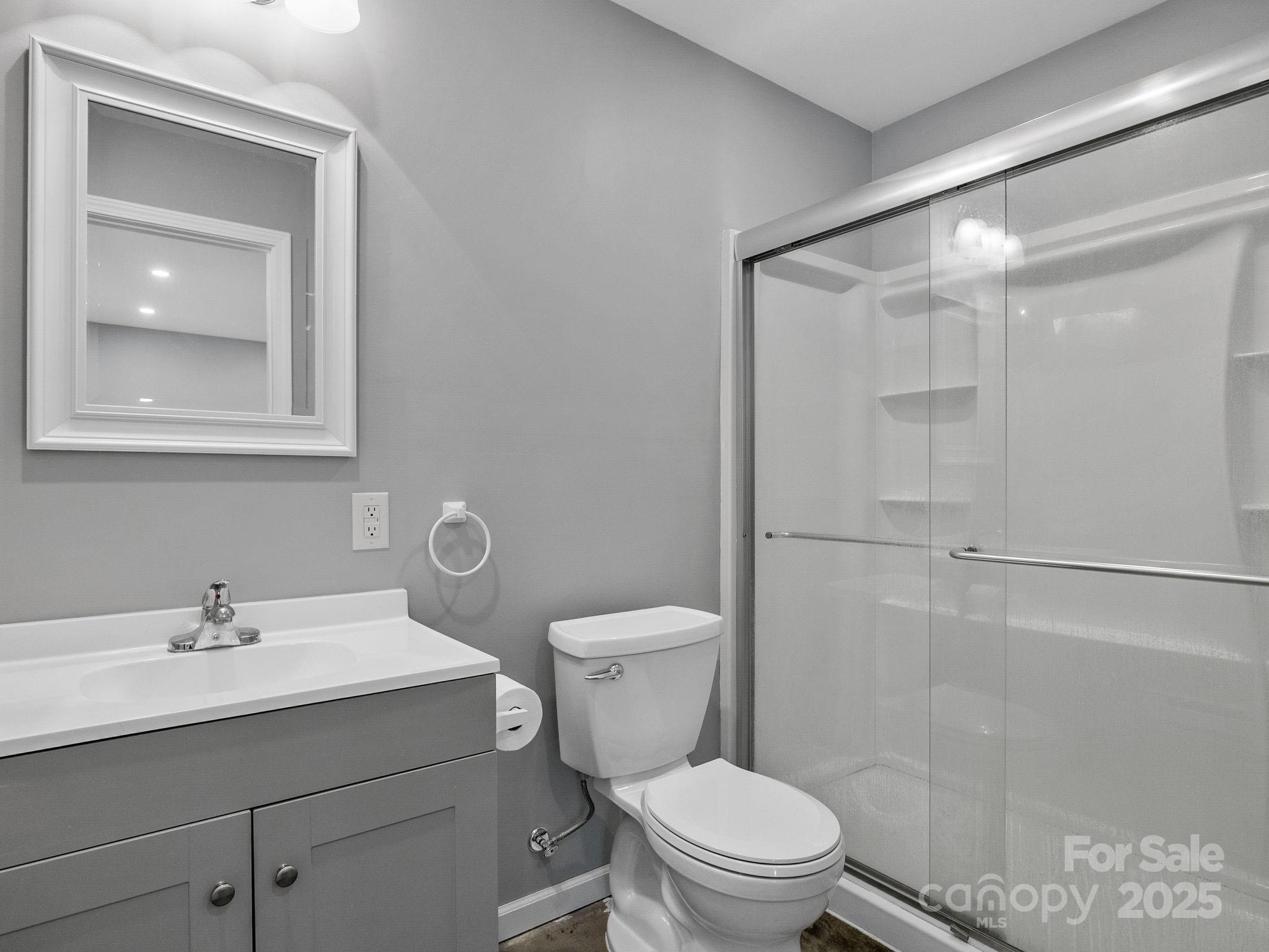 185 Robinson Acres Cove Lane Rutherfordton, NC 28139 - Photo 34 of 37 a bathroom with a sink a toilet and shower