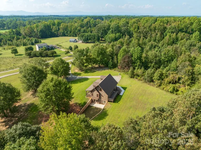 a view of a lake with houses in back