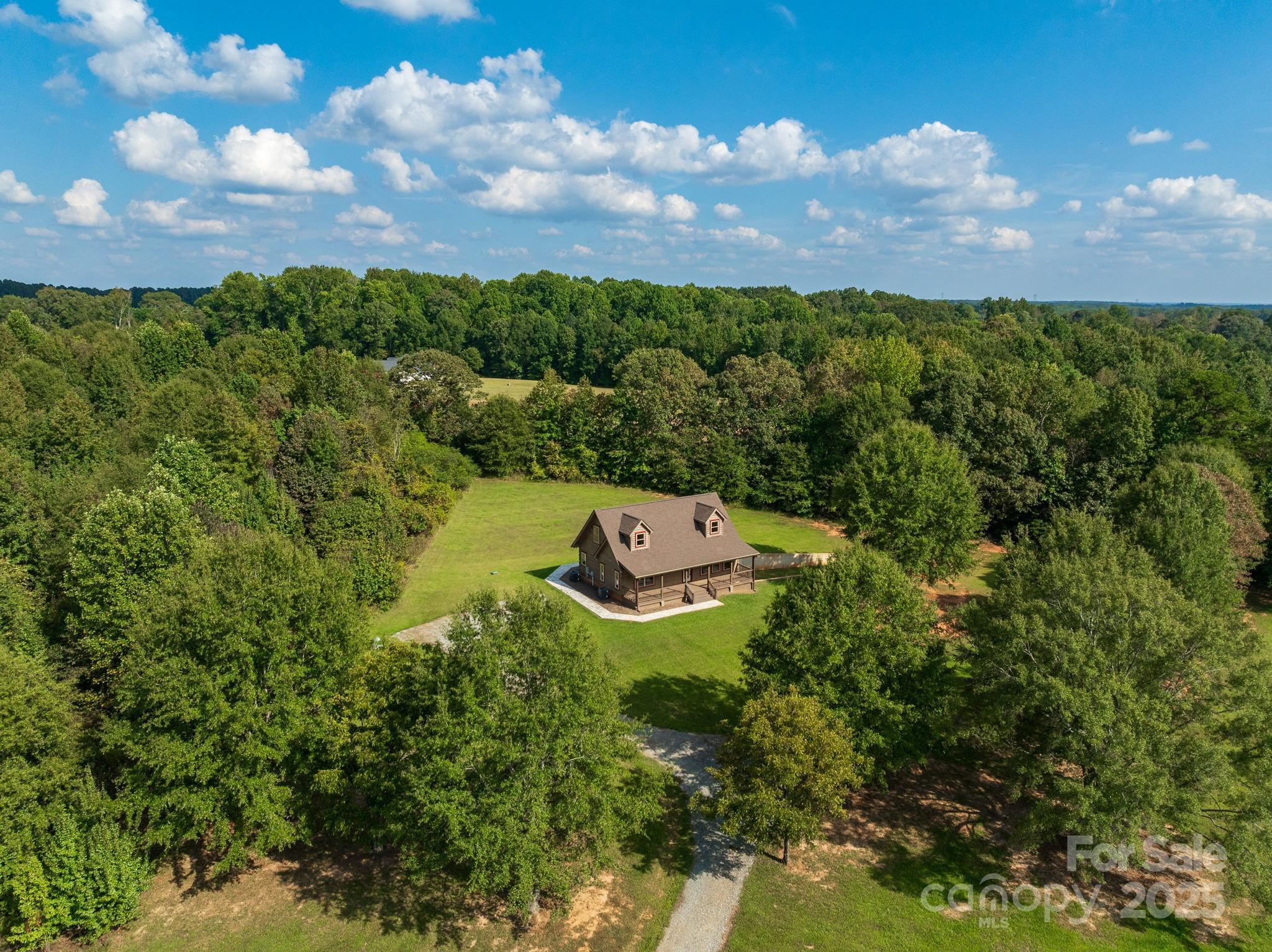 185 Robinson Acres Cove Lane Rutherfordton, NC 28139 - Photo 36 of 37 a view of a lake with houses in back