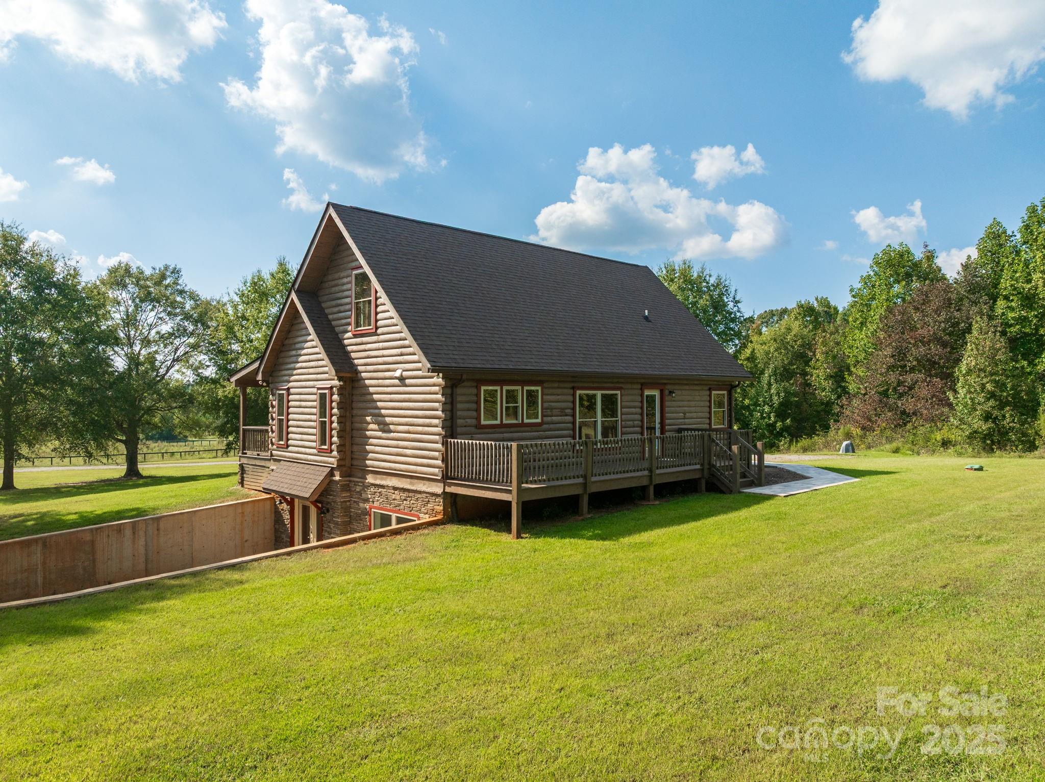 185 Robinson Acres Cove Lane Rutherfordton, NC 28139 - Photo 5 of 37 a view of a house with backyard and a tree