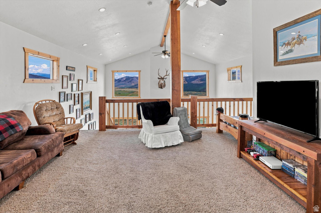 715 Ranch Loop Road Preston, ID 83263 - Photo 34 of 77 Expansive loft area featuring vaulted ceilings, recessed lighting, and multiple windows with wood-trim framing