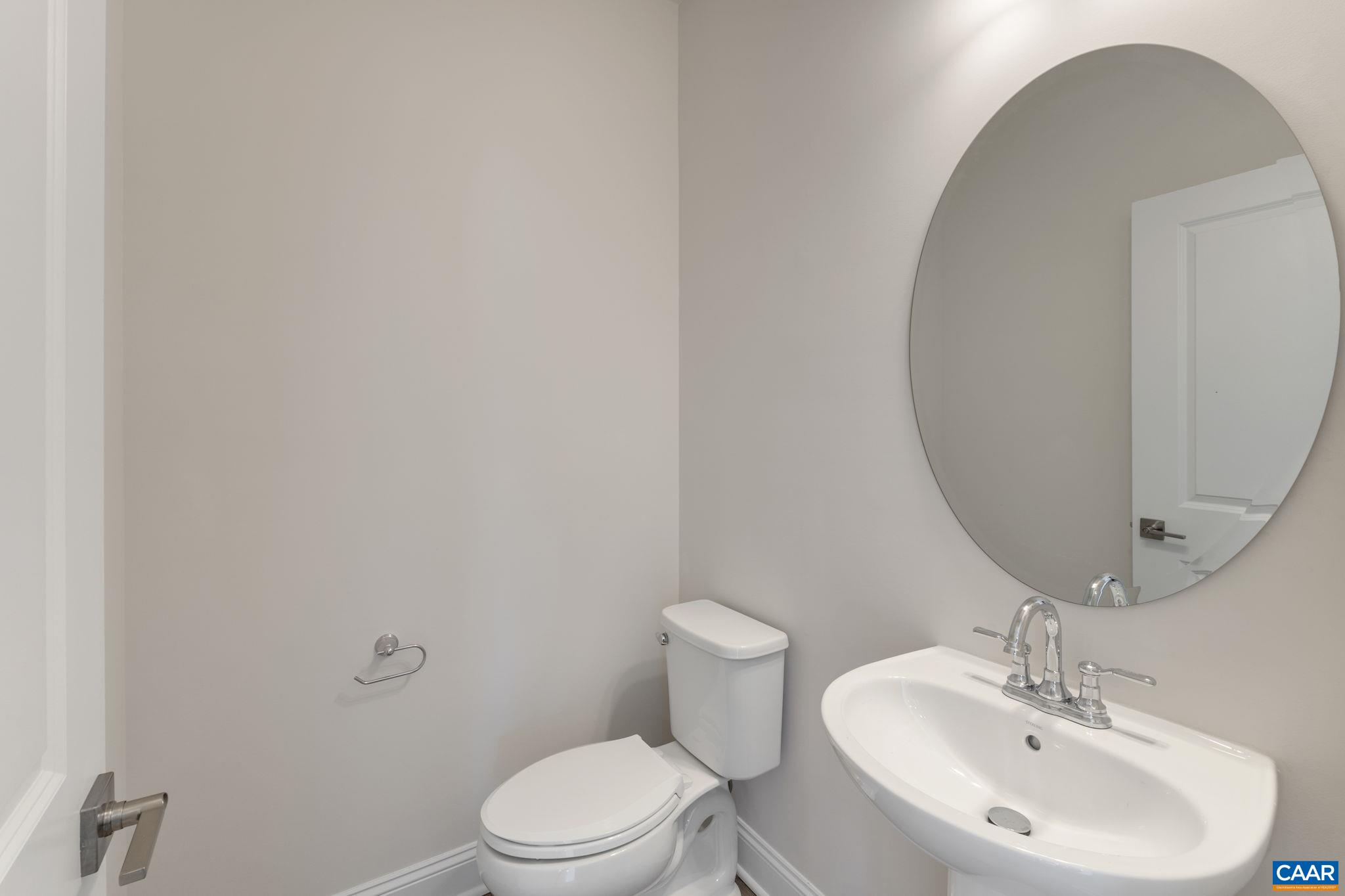 32 Talen Lane Charlottesville, VA 22911 - Photo 14 of 37 a bathroom with a sink a toilet and mirror