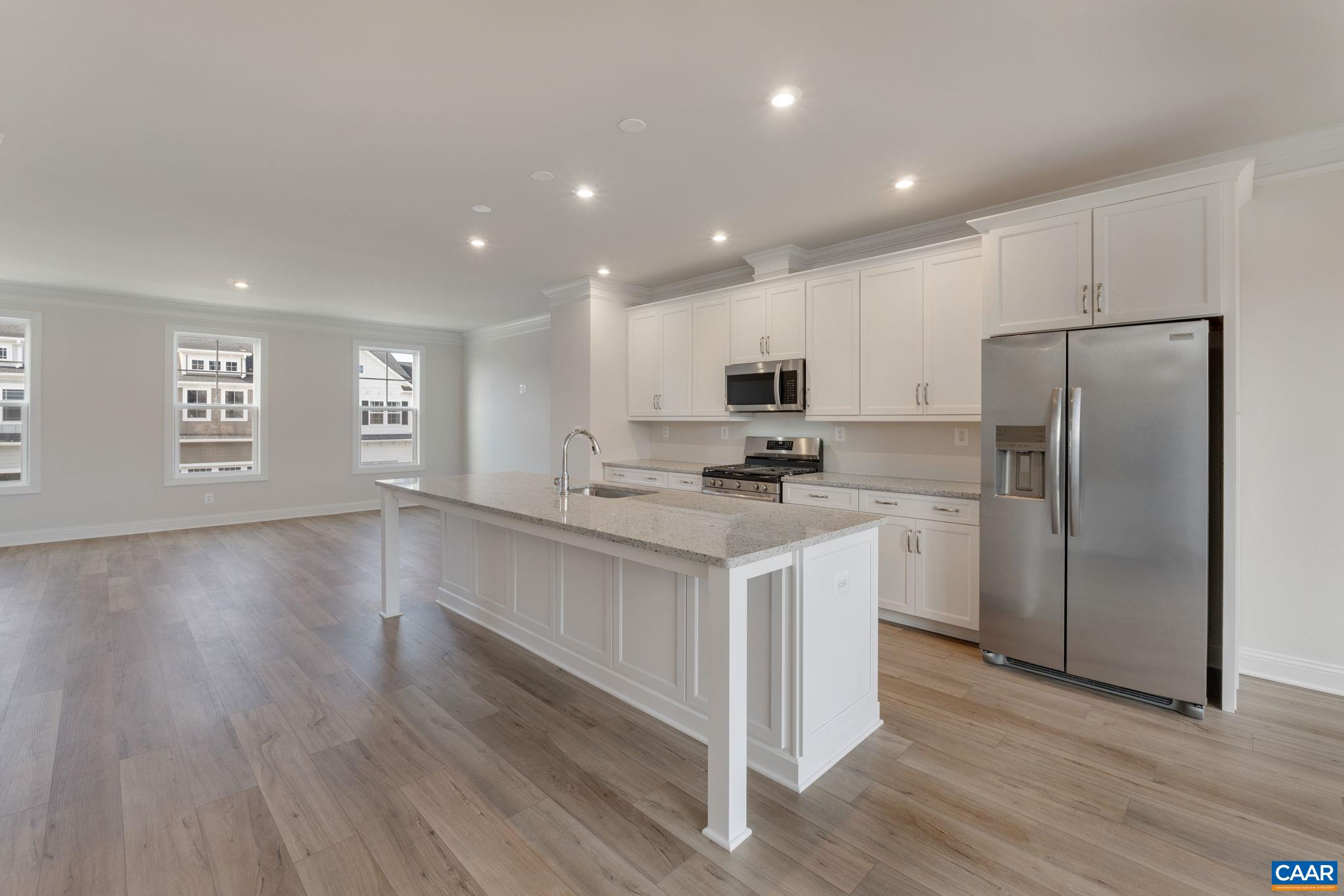 32 Talen Lane Charlottesville, VA 22911 - Photo 15 of 37 a kitchen with white cabinets and wooden floor