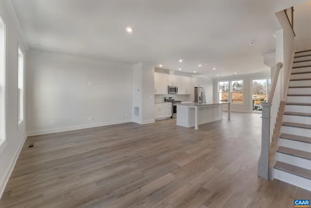 a view of a kitchen with a table and chairs