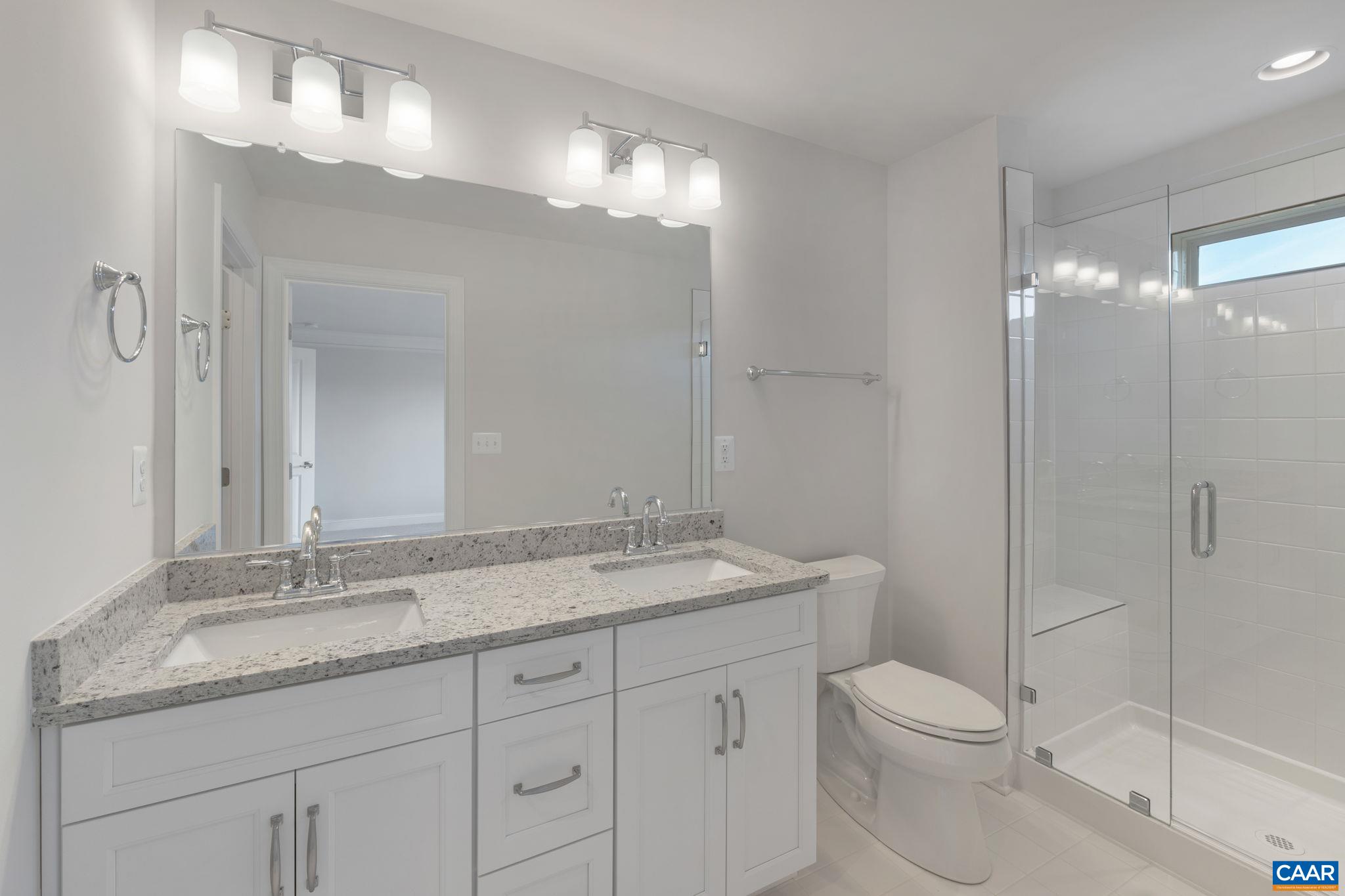 32 Talen Lane Charlottesville, VA 22911 - Photo 26 of 37 a bathroom with a granite countertop sink a toilet and a mirror