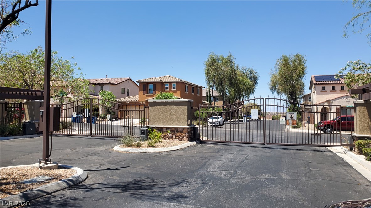 7903 Dell Ridge Avenue Las Vegas, NV 89179 - Photo 20 of 20 Secure community entrance with durable wrought iron gates.