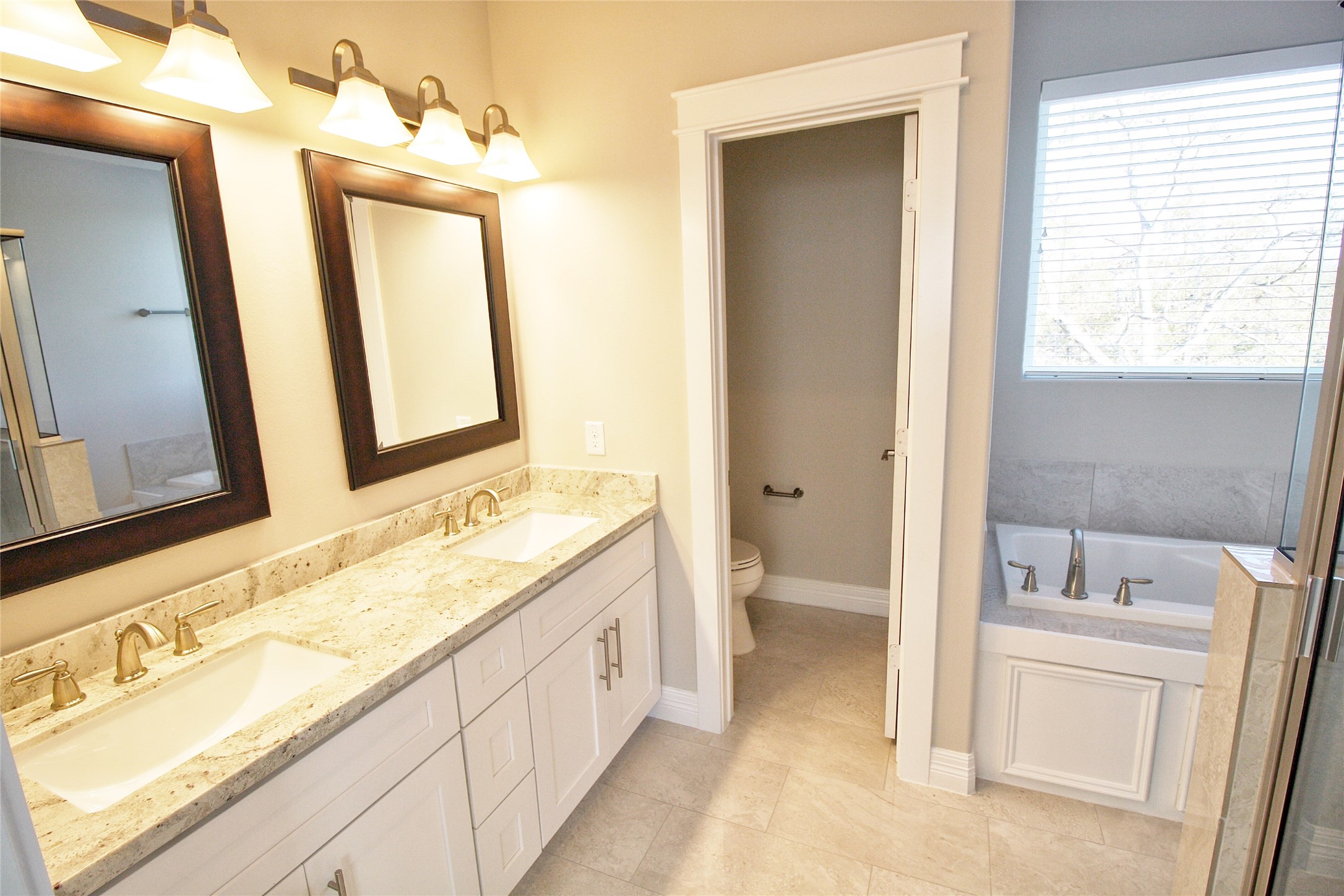 709 Link Road Houston, TX 77009 - Photo 21 of 46 a spacious bathroom with a double vanity sink mirror and a