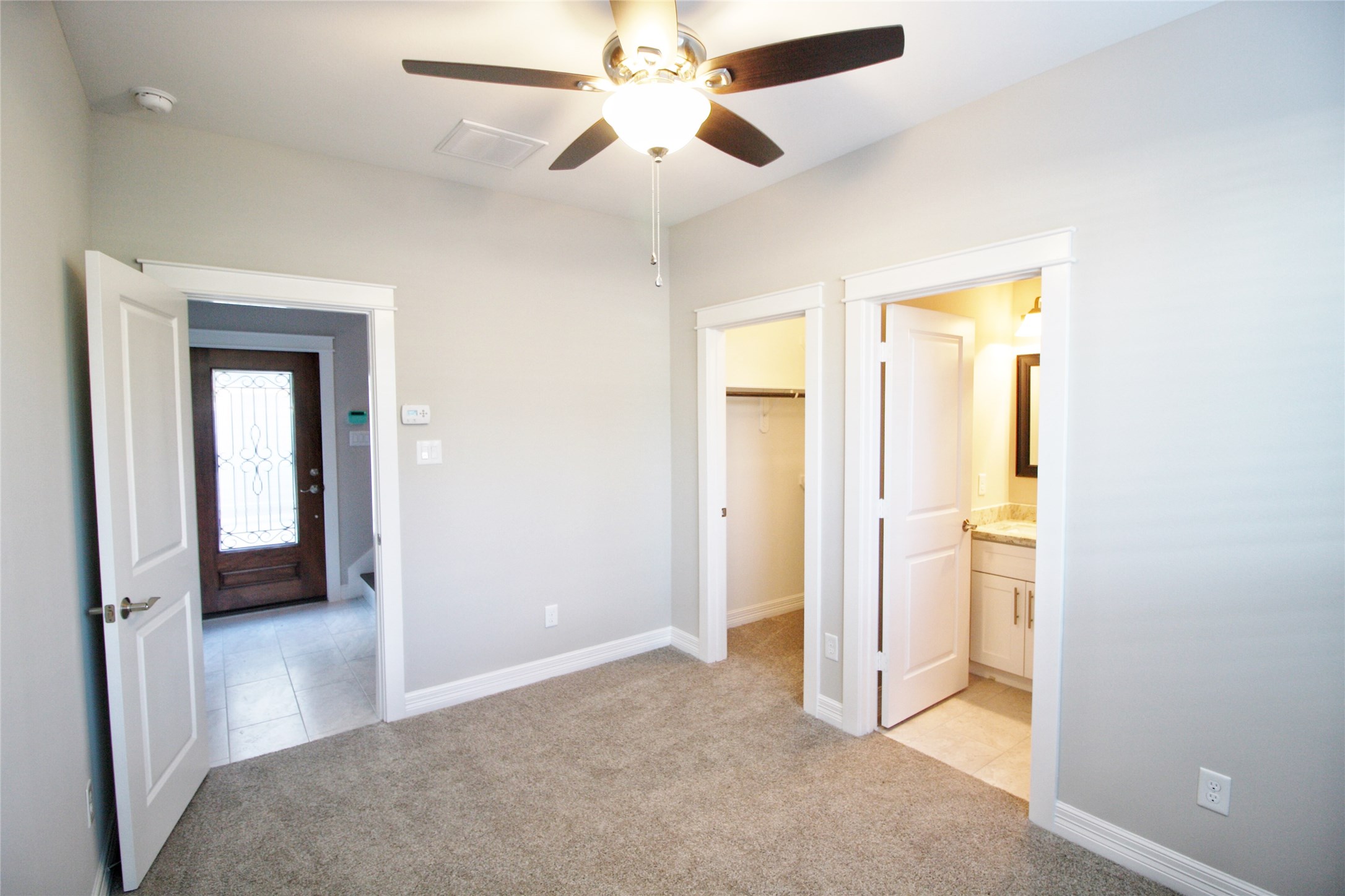 709 Link Road Houston, TX 77009 - Photo 28 of 46 a view of a hallway with a chandelier fan and windows