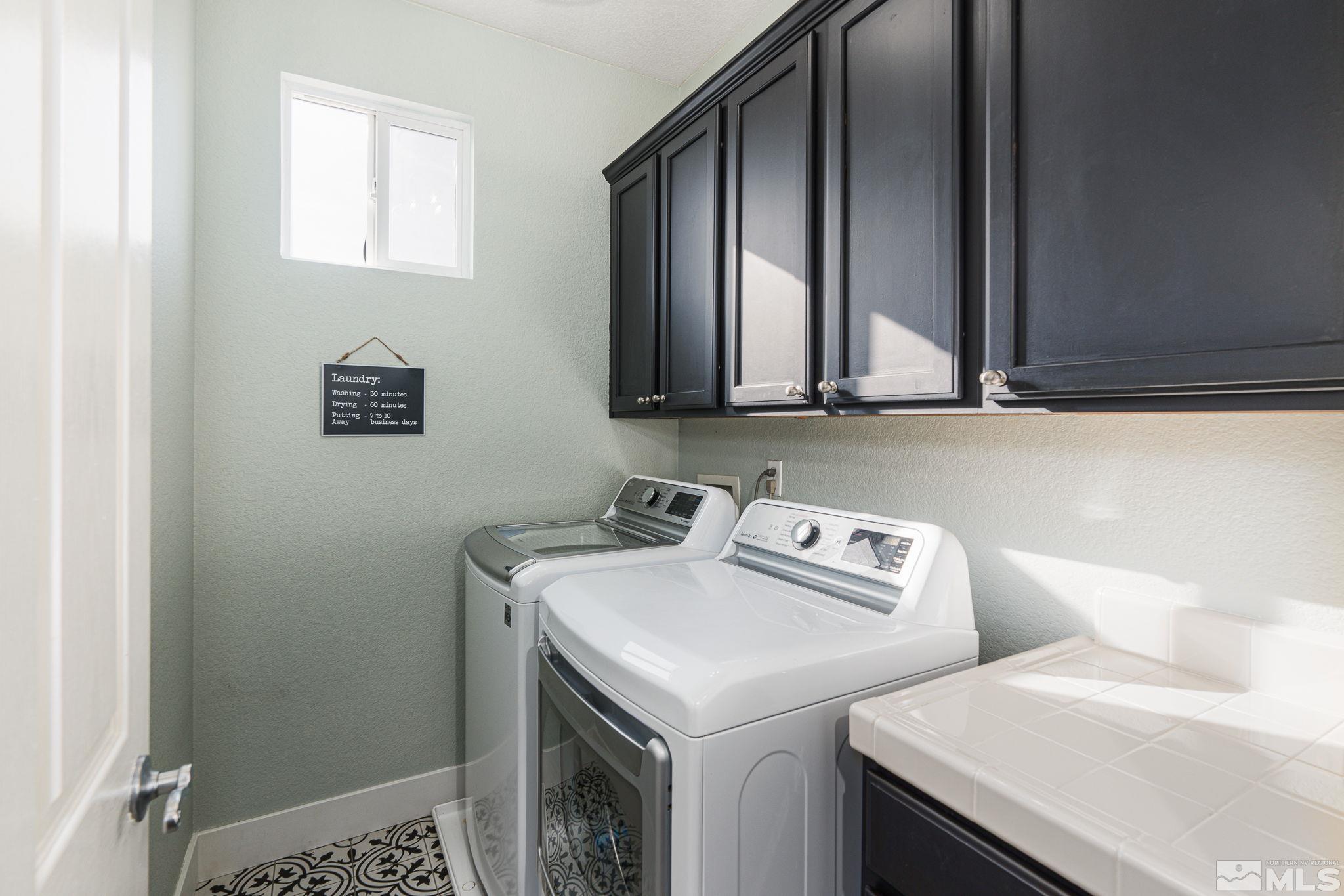 10650 Copper Lake Drive Reno, NV 89521 - Photo 29 of 40 a utility room with dryer and washer