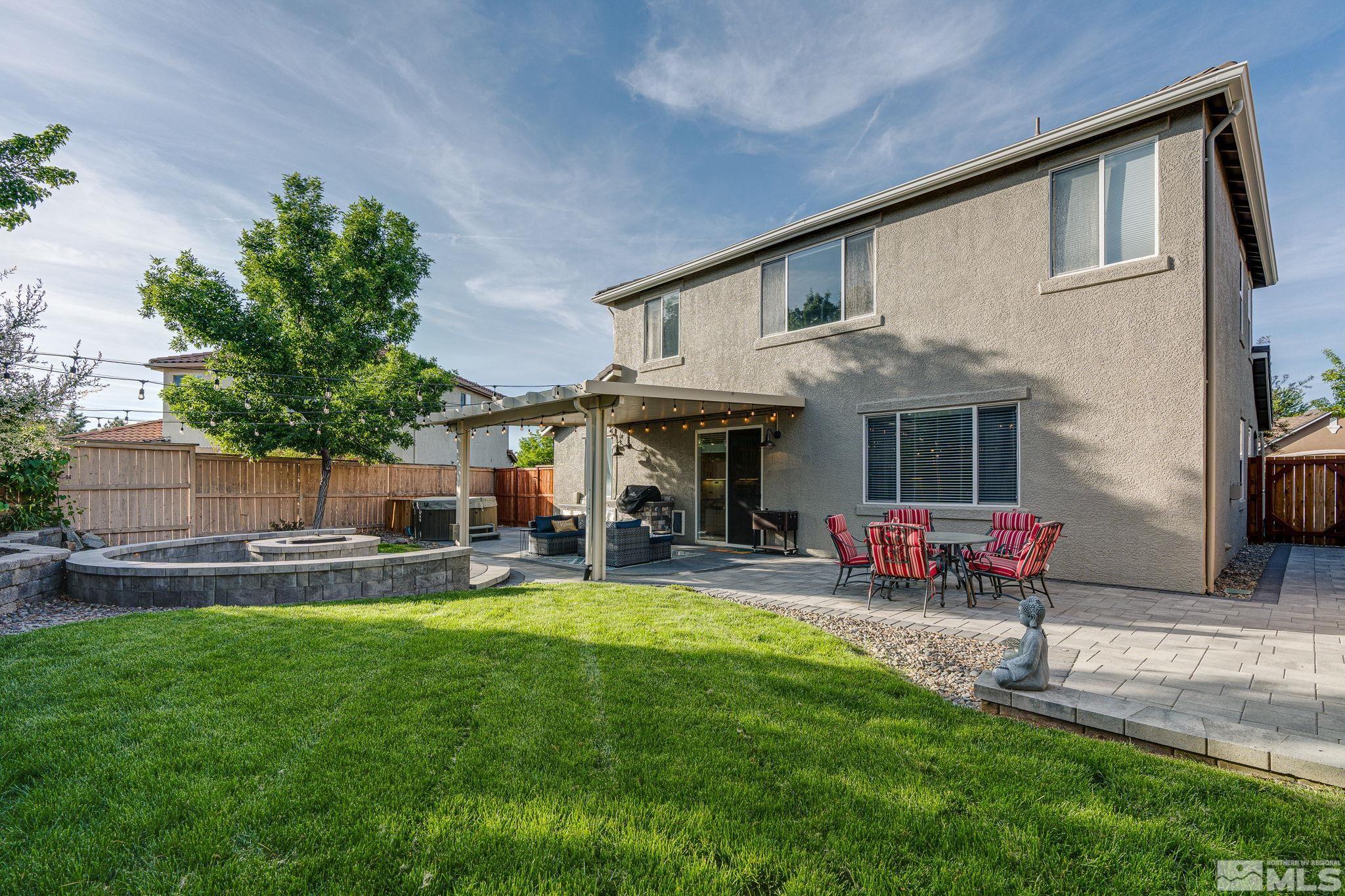 10650 Copper Lake Drive Reno, NV 89521 - Photo 30 of 40 a view of a house with a yard and sitting area