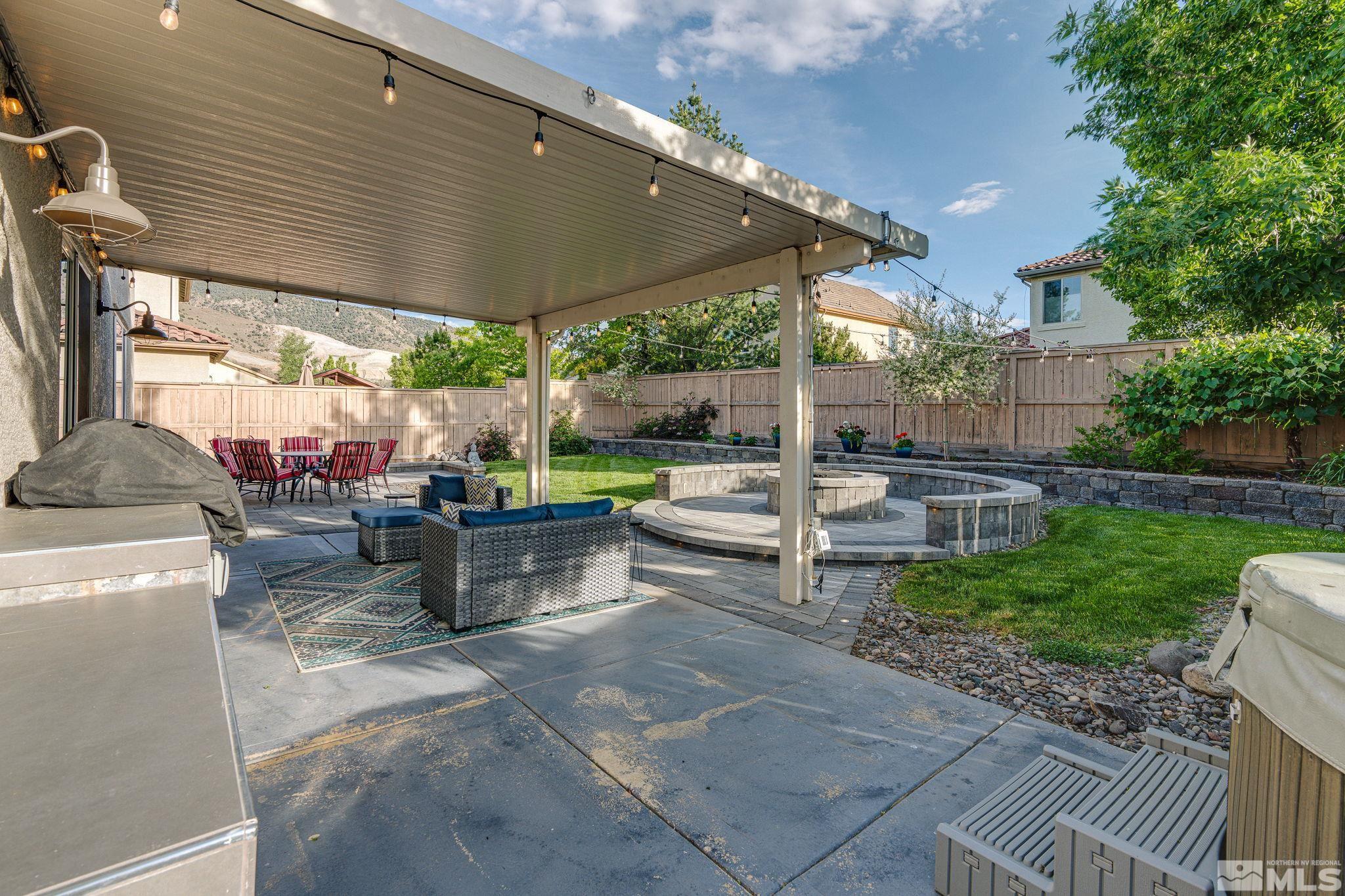 10650 Copper Lake Drive Reno, NV 89521 - Photo 38 of 40 a view of a patio with chairs and a patio