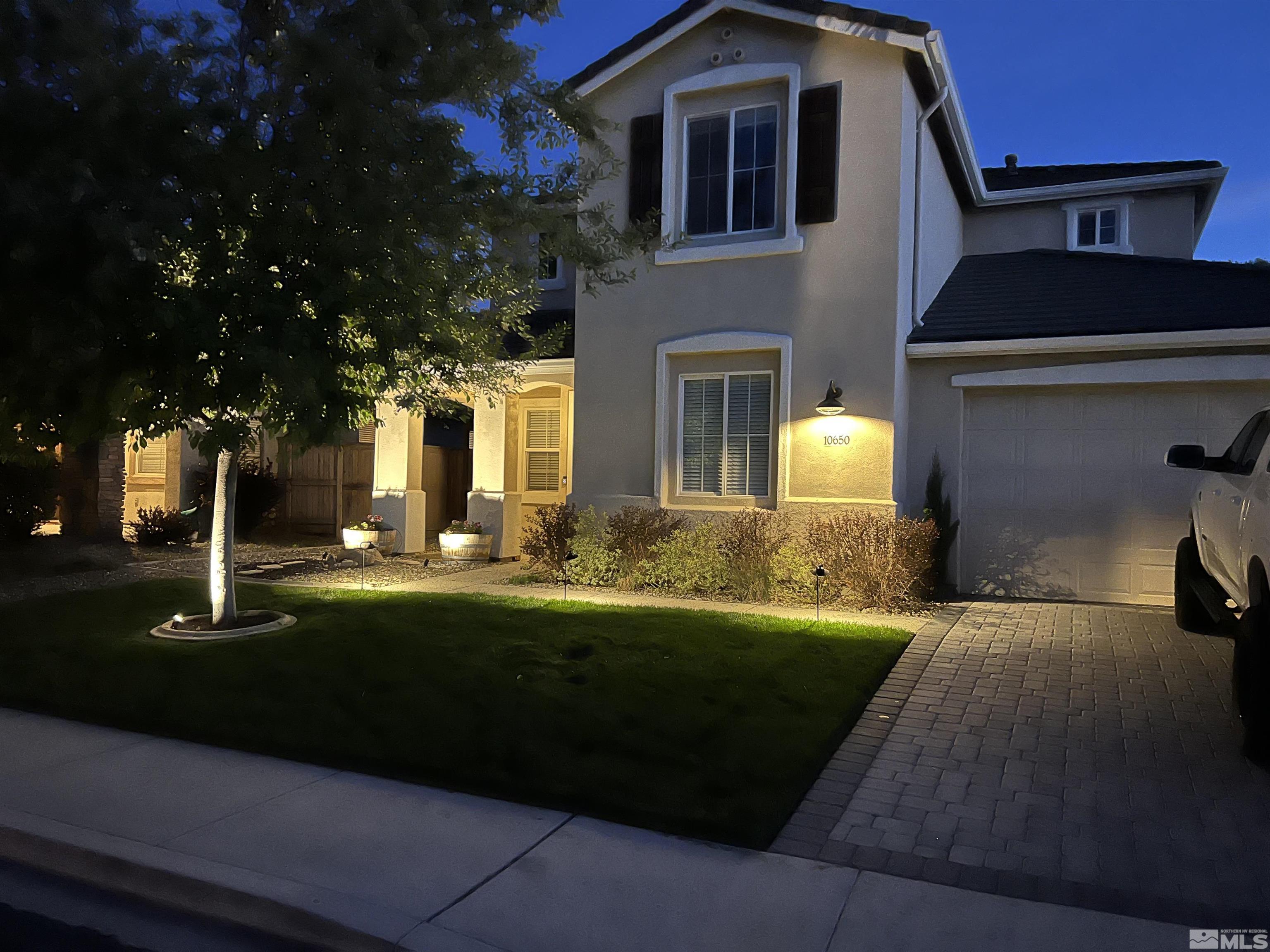 10650 Copper Lake Drive Reno, NV 89521 - Photo 4 of 40 a front view of a house with a yard