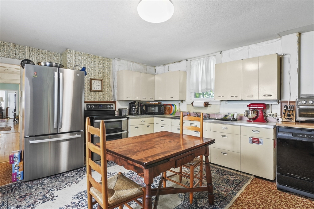 90 Common Street Barre, MA 01005 - Photo 16 of 27 a kitchen with granite countertop a refrigerator stove top oven and sink