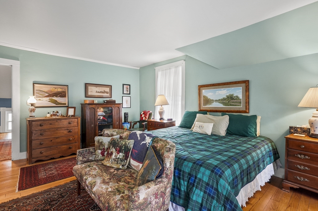 90 Common Street Barre, MA 01005 - Photo 26 of 27 a bedroom with a bed painting on wall and two windows