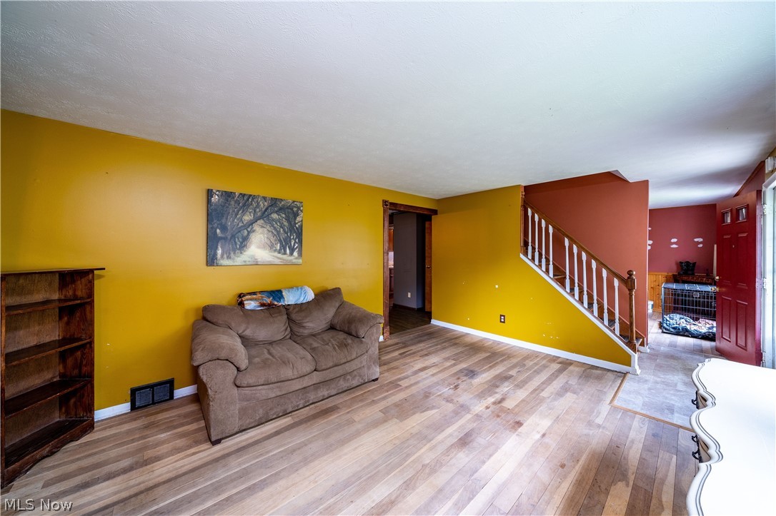 3754 Vira Road Stow, OH 44224 - Photo 10 of 35 3754 Vira Rd, Stow, OH 44224 won't last long! 4 Bedrooms & full bath on the 2nd floor as well as half bath on the 1st floor, separate Living Room, Family Room with beautiful Fireplace, gorgeous Sunroom with sliding doors to the huge deck with fenced rear yard & tool shed, Kitchen & Dining Room with wood floors; Full basement with half finished for recreation Room & other half as workshop & Hobby area as well as Laundry Hookups & Utilities.