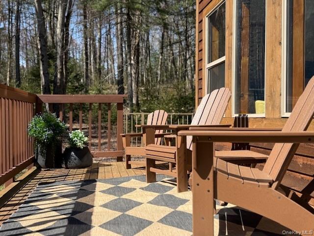 front porch deck to linger and enjoy the woods and nature