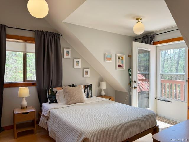 2769 State Rte 55 Bethel, NY 12786 - Photo 17 of 28 with private door open to a balcony overlooking the yardand a walk in closet