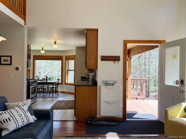 2769 State Rte 55 Bethel, NY 12786 - Photo 7 of 28 Looking for from the fireplace out the front door and into the kitchen