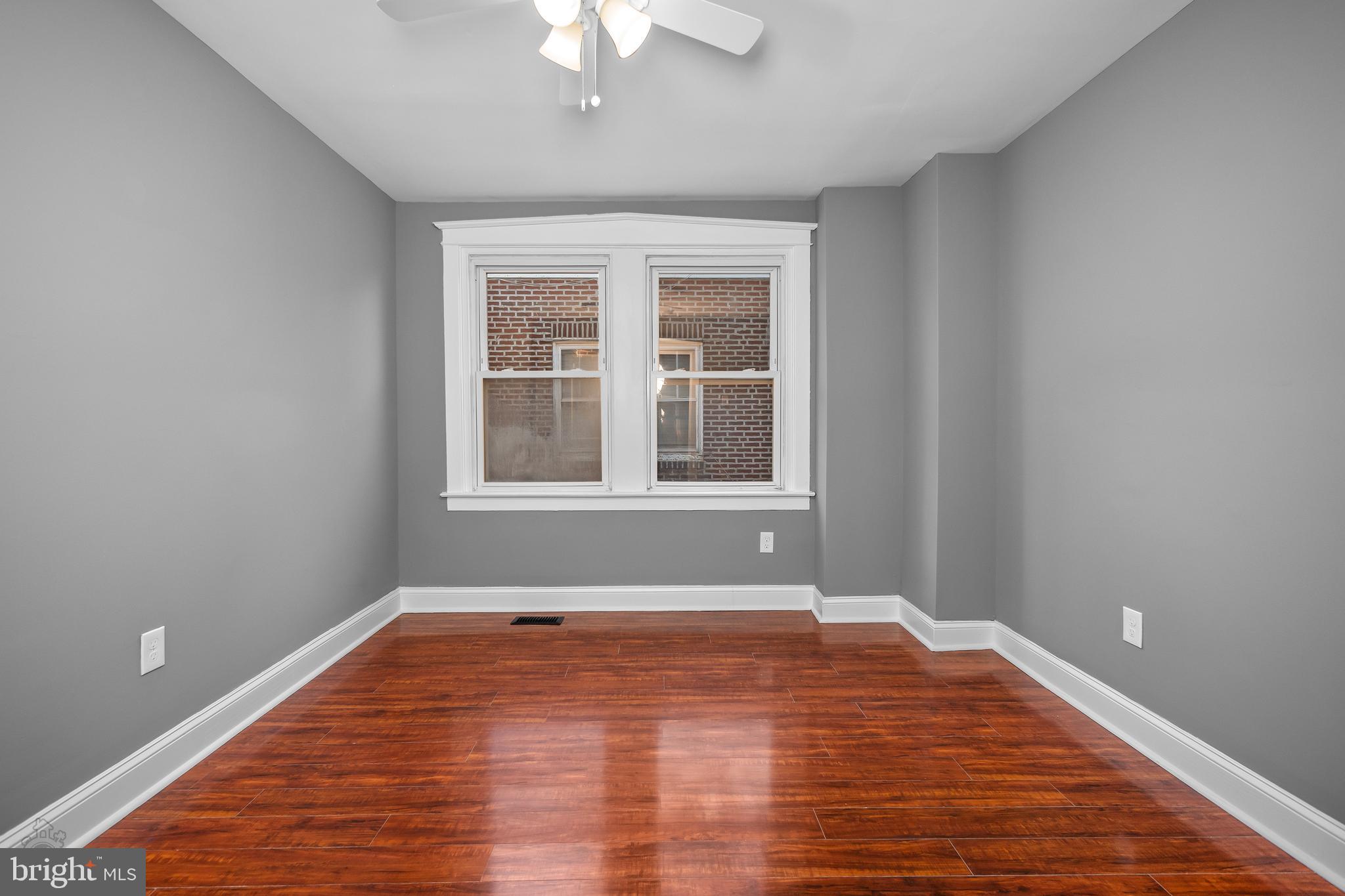 558 East Locust Avenue Philadelphia, PA 19144 - Photo 19 of 33 a view of empty room with wooden floor and fan