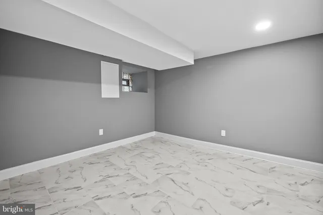 a bathroom with a toilet a sink and a window