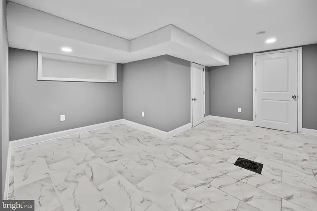 a big room with closet and windows