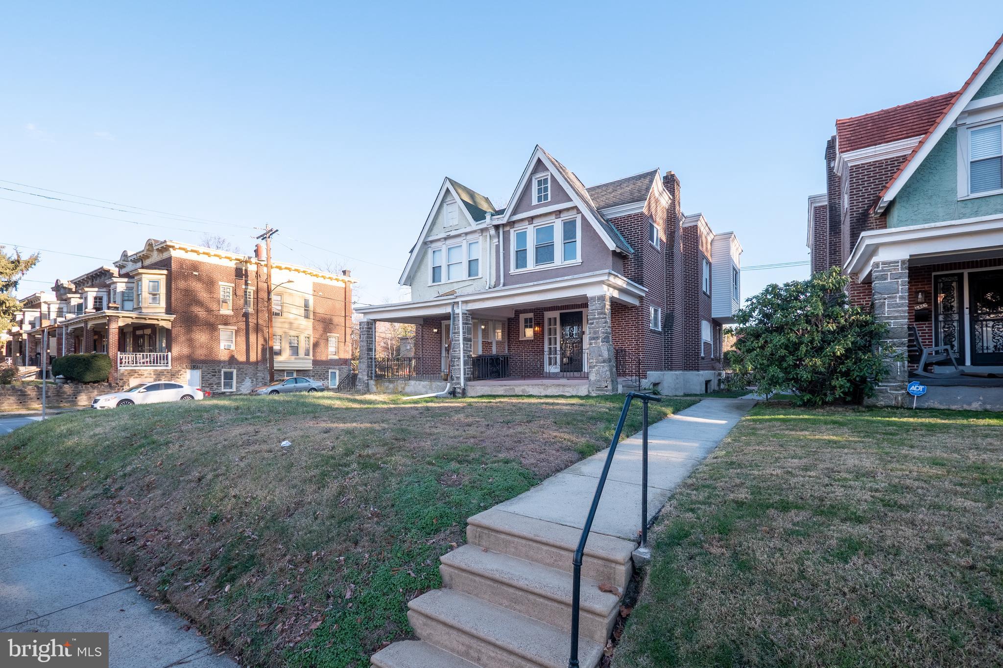 558 East Locust Avenue Philadelphia, PA 19144 - Photo 28 of 33 a front view of a house with a yard