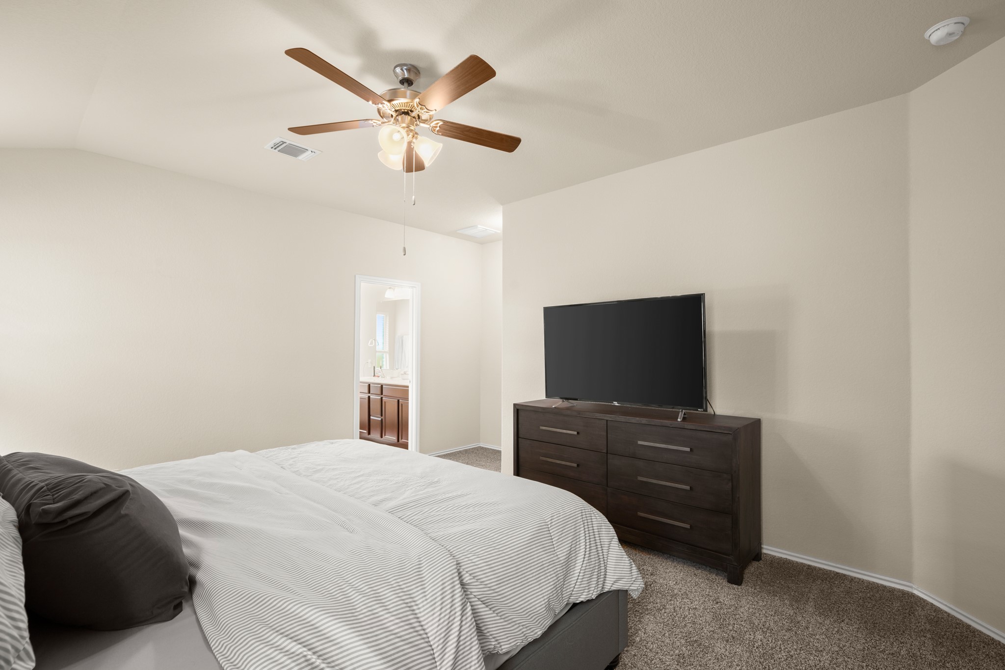 5526 Perdita Drive Belton, TX 76513 - Photo 12 of 26 Bedroom with carpet, a ceiling fan, lofted ceiling, and ensuite bathroom